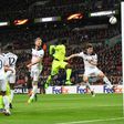 Tottenham Hotspur's striker Harry Kane (C) watches as his defensive header goes into his own goal to score an own goal to level the scores 1-1 during the UEFA Europa League football match between Tottenham Hotspur and KAA Gent on February 23, 2017