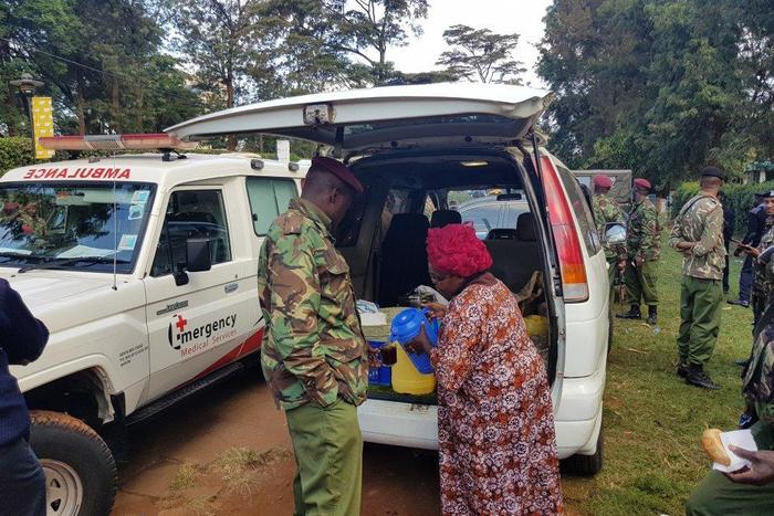Kenyan woman serves tea to the police in the wake of the Riverside terror attack (Photo courtesy)