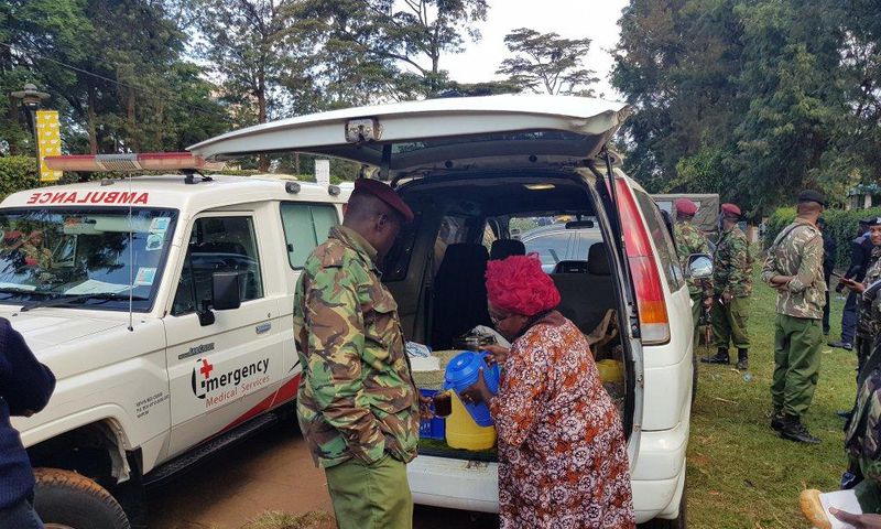 Kenyan woman serves tea to the police in the wake of the Riverside terror attack (Photo courtesy)