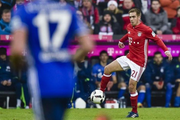 Bayern Munich's defender Philipp Lahm plays his 500th match during the German first division Bundesliga football match between FC Bayern Munich and FC Schalke 04 in Munich, southern Germany, on February 4, 2017