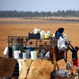 Displaced Syrians, who fled their hometowns due to clashes between regime forces and the Islamic State (IS) group, prepare food in Kharufiyah, 18 kilometres south of Manbij, on March 4, 2017