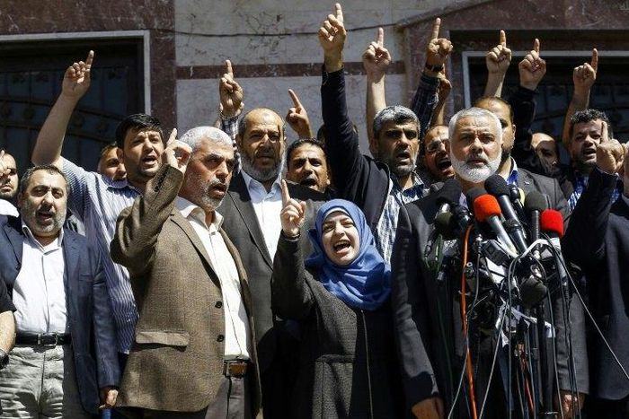 Ismail Haniya (R-2), leader of the Palestinian Islamist movement Hamas, gives a press conference in Gaza City on May 11, 2017, announcing the arrest of the suspected killer of one of its key military commanders, Mazen Faqha