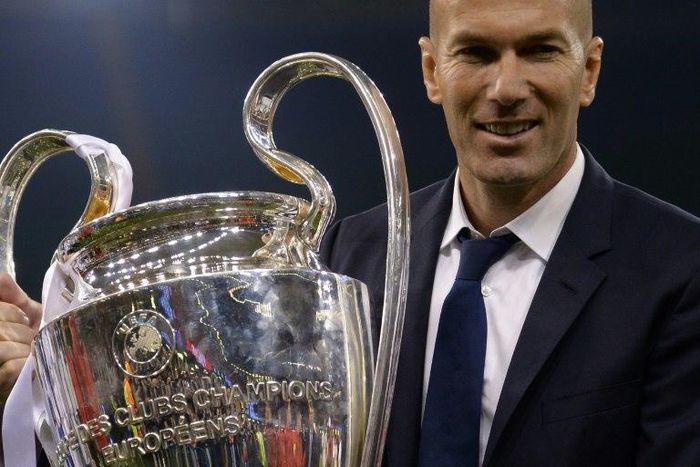 Real Madrid's coach Zinedine Zidane lifts the trophy after Real Madrid won the UEFA Champions League final on June 3, 2017