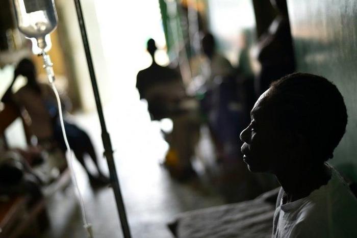 A patient with cholera symptoms receives medical attention at the health center of Les Anglais, in Les Cayes in the southwest of Haiti on October 16, 2016