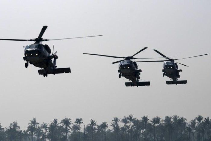 Taiwanese military helicopters fly in formation during a drill in Kaohsiung in January 2017