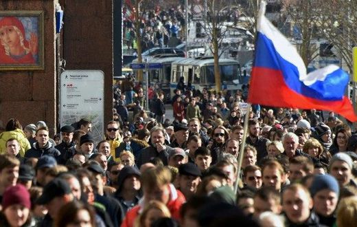 Protesters walk along Moscow's Tverskaya street during an unauthorised anti-corruption rally on March 26, 2017