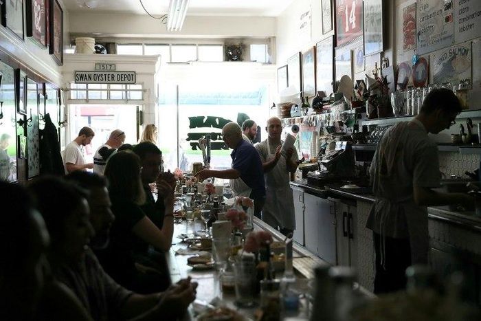 Swan Oyster Depot patrons sit in the dark during a citywide power outage on April 21, 2017 in San Francisco, California