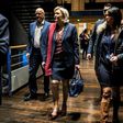 French presidential election candidate for the far-right Front National (FN) party Marine Le Pen (C) arrives at political rally to kick off her campaign next to her aide Catherine Griset (R) and bodyguard Thierry Legier (L) February 4, 2017