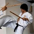 Students demonstrate their fighting skills with sticks during a training session in the ancient Indonesian martial art of "pencak silat" in Jakarta, Indonesia