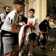 Juventus supporters carry an injured woman in Piazza San Carlo in Turin after a stampede in the fanzone where fans were watching the Champions League Final between Juventus and Real Madrid on a giant screen, on June 3, 2017