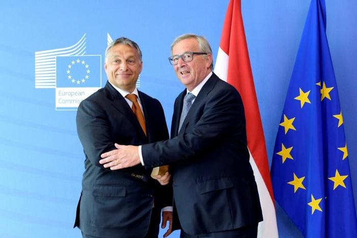 Juncker (R) has called for the Fidesz party of Orban (L) to be excluded from the EPP
