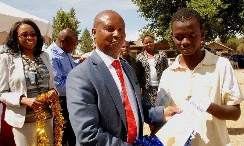 Nakuru Governor Kinuthia Mbugua awards a youth with a computer certificates for excelling in a youth empowerment program funded by the Kiamaina Bursary. The Nakuru County Public Service Board is under investigation after reports revealed that it recrui...