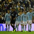 Celta Vigo's midfielder Daniel Wass (2ndR) is congratulated by teammates after scoring during the Spanish Copa del Rey quarter final second leg football match against Real Madrid January 25, 2017