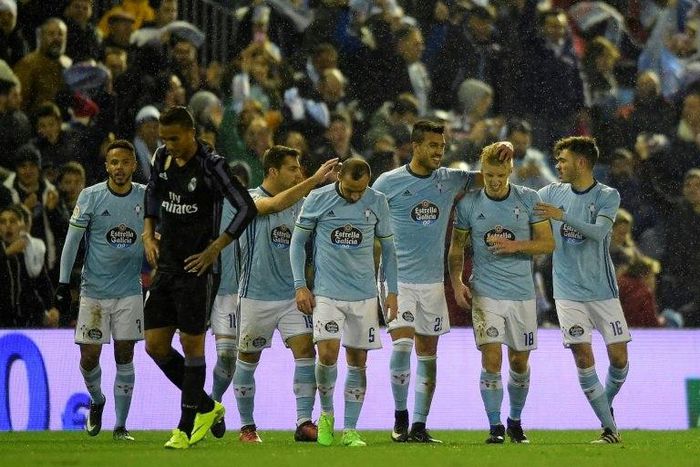 Celta Vigo's midfielder Daniel Wass (2ndR) is congratulated by teammates after scoring during the Spanish Copa del Rey quarter final second leg football match against Real Madrid January 25, 2017