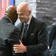 Head of FIFA's monitoring mission on the Israel-Palestinian issue of football, South Africa's Tokyo Sexwale (L)hugs FIFA President Gianni Infantino after a meeting of the FIFA Council on October 14, 2016