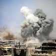 Smoke rises from buildings following a reported air strike on a rebel-held area in the southern Syrian city of Daraa, on May 22, 2017