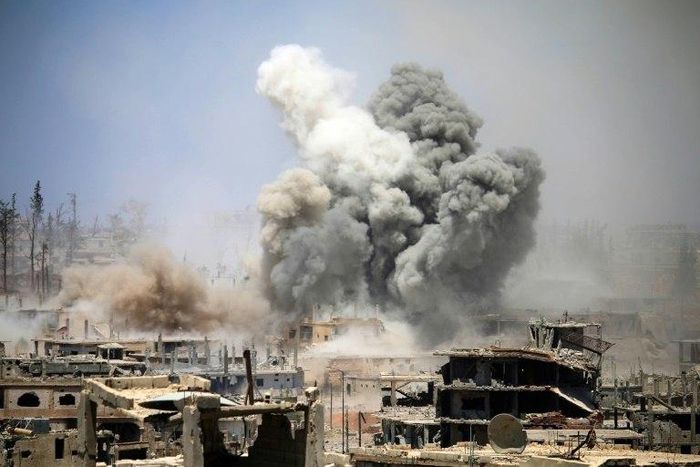 Smoke rises from buildings following a reported air strike on a rebel-held area in the southern Syrian city of Daraa, on May 22, 2017