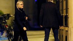 French presidential candidate Francois Fillon's wife, Penelope, seen her outside her Paris apartment, has also been charged in the fake jobs affair