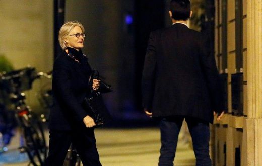 French presidential candidate Francois Fillon's wife, Penelope, seen her outside her Paris apartment, has also been charged in the fake jobs affair