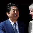 Britain's Prime Minister Theresa May (R) welcomes Japan's Prime Minister Shinzo Abe (L) at Chequers, the prime minister's official country residence, near Ellesborough, northwest of London, on April 28, 2017