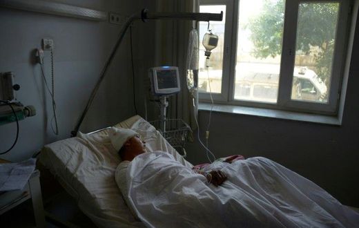 A wounded Afghan soldier in hospital in Mazar-i-Sharif on April 22, 2017, following a bloody Taliban attack on an army base