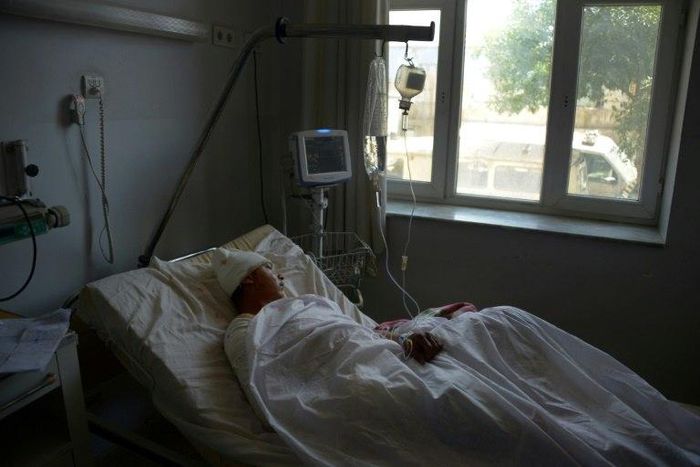 A wounded Afghan soldier in hospital in Mazar-i-Sharif on April 22, 2017, following a bloody Taliban attack on an army base
