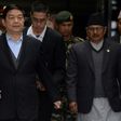 China's Defence Minister Chang Wanquan (L) is escorted by Nepalese officials after his arrival at Tribhuwan International Airport in Kathmandu on March 23, 2017