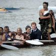 Britain's Prince Harry (2nd R) took a canoe ride along the Whanganui river, the third longest in New Zealand, on a trip to the country in May 2015