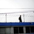 A soldier guards the correctional centre for minors, 'Las Gaviotas', in Guatemala City on July 7, 2015