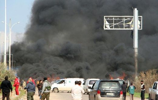 Smoke billows from the site of a suicide car bombing in Rashidin, west of Aleppo, that targeted buses carrying Syrian evacuees on April 15, 2017