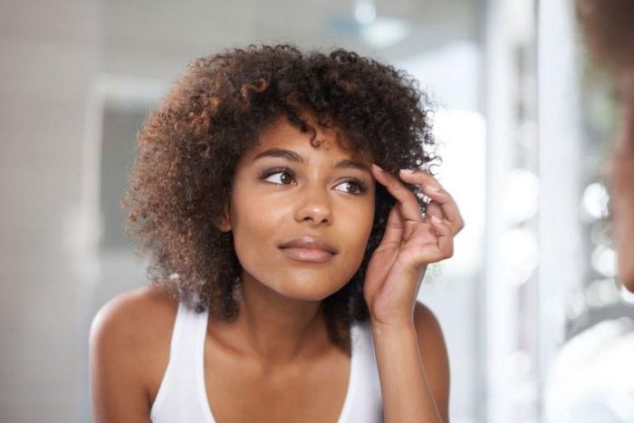 They appear in large, cystic groupings on the face and neck.