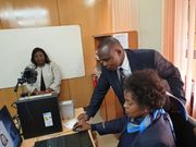 Ida Odinga having photo taken during E-passport application (Twitter)