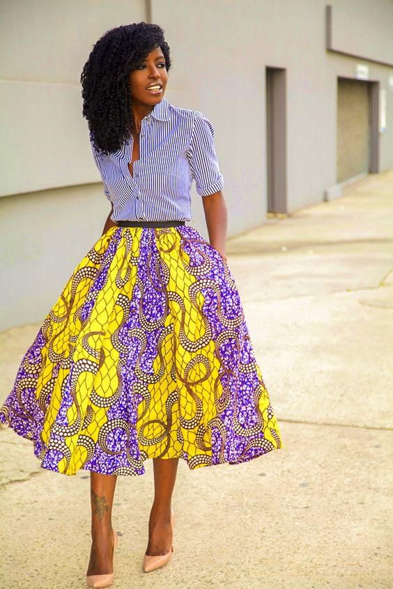 African woman rocking midi skirt and shirt
