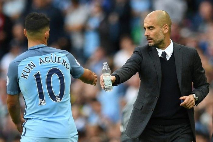 Manchester City manager Pep Guardiola (right) and the club's Argentine striker Sergio Aguero