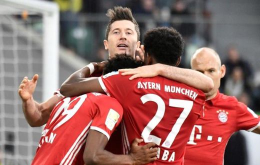 Bayern Munich celebrates after scoring during their German first division Bundesliga football match against Wolfsburg on April 29, 2017 in Wolfsburg, northern Germany