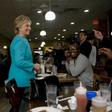Democratic presidential nominee Hillary Clinton visits with customers at the Cedar Park Cafe on November 6, 2016 in Philadelphia, Pennsylvania