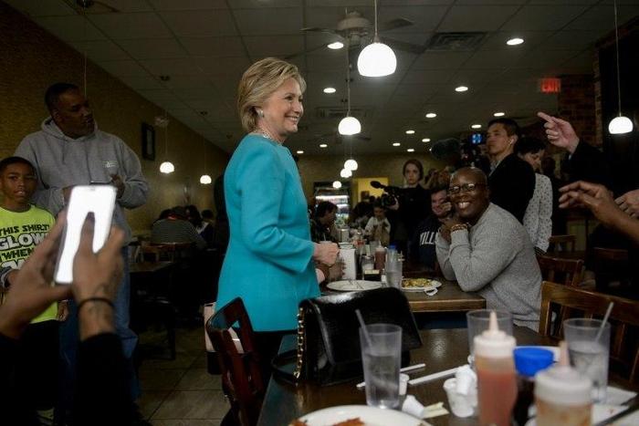 Democratic presidential nominee Hillary Clinton visits with customers at the Cedar Park Cafe on November 6, 2016 in Philadelphia, Pennsylvania