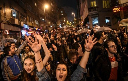Supporters of the "No" gesture and shout in Istanbul to protest alleged poll violations