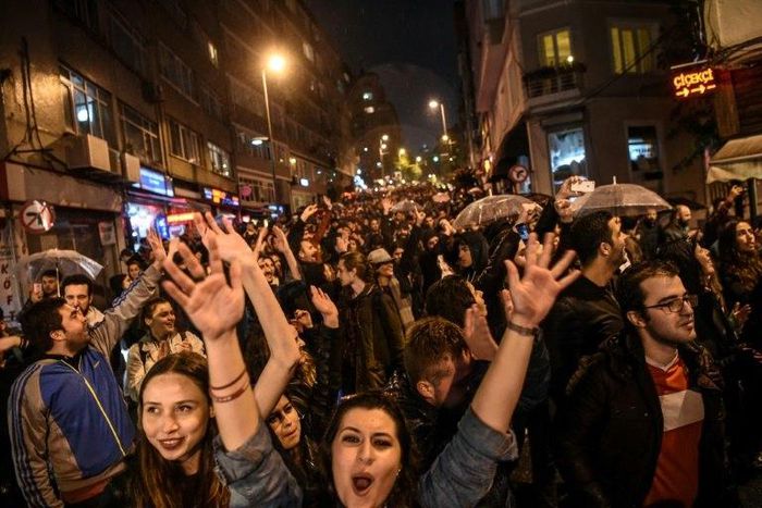 Supporters of the "No" gesture and shout in Istanbul to protest alleged poll violations