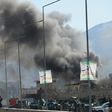Smoke rises from an Afghan police headquarters building in Kabul after a suicide car bombing on March 1, 2017
