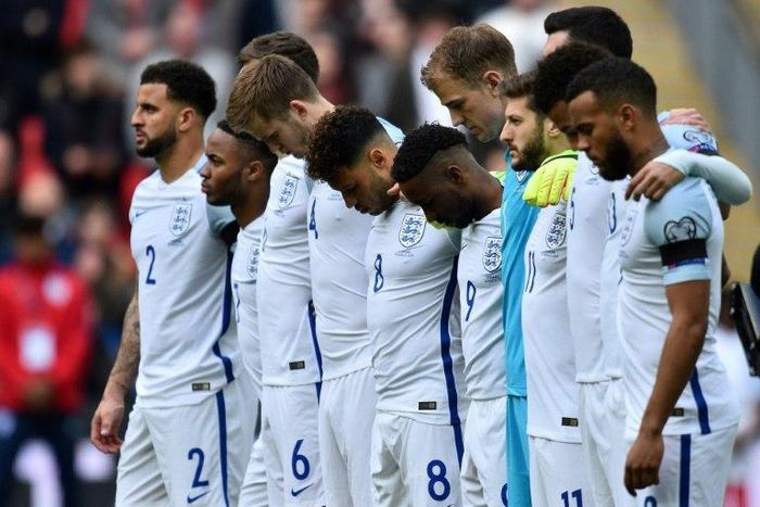 England players observe a minute of silence for the victims of the Westminster terror attack ahead of the World Cup 2018 qualification football match at Wembley Stadium