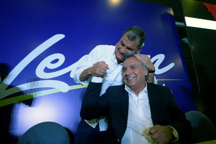 Ecuadorian President Rafael Correa (L) hugs Lenin Moreno during a post-election rally in Quito, on February 19, 2017