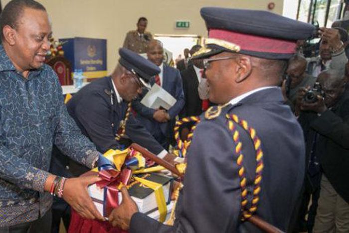 Former IG Joseph Boinnet with President Uhuru Kenyatta
