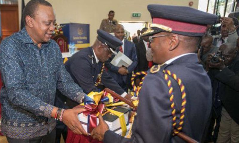 Former IG Joseph Boinnet with President Uhuru Kenyatta