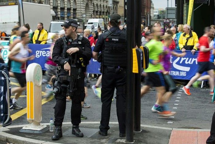 Some 40,000 runners are taking part in the annual half marathon through Manchester which is being held under tight security with armed police along the route
