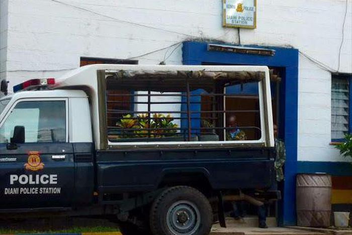 A police vehicle parked outside a police station