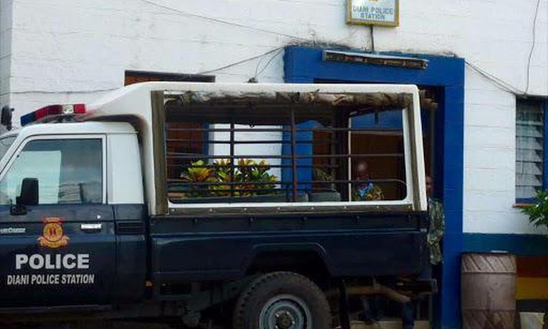 A police vehicle parked outside a police station
