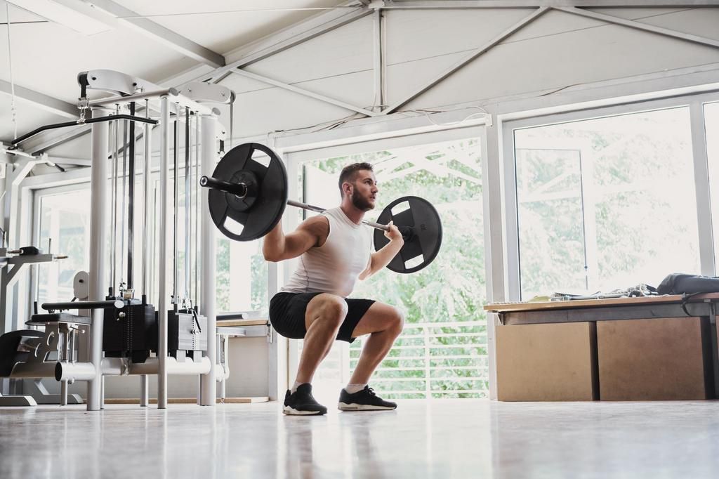Young man doing Dead lifts