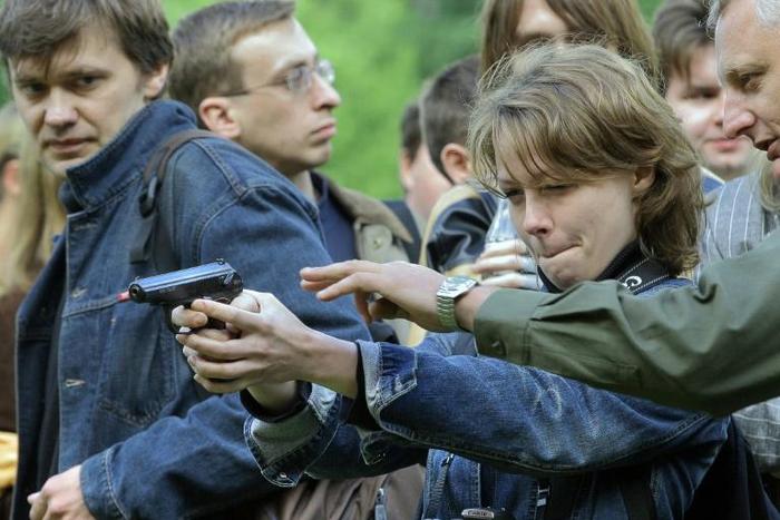 Russia's Soviet-era Makarov pistols, seen here being tried out by journalists at a Moscow weapons shop, has long been used by police and the army