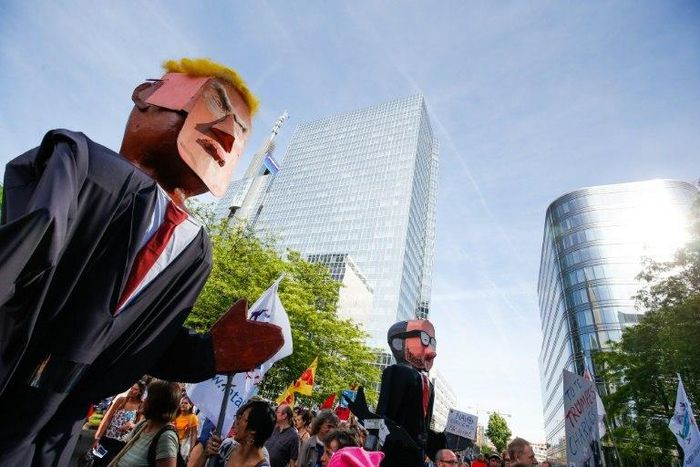 Protesters carried effigies of US President Donald Trump as well as Belgian Prime Minister Charles Michel during a demonstration in Brussels on Wednesday